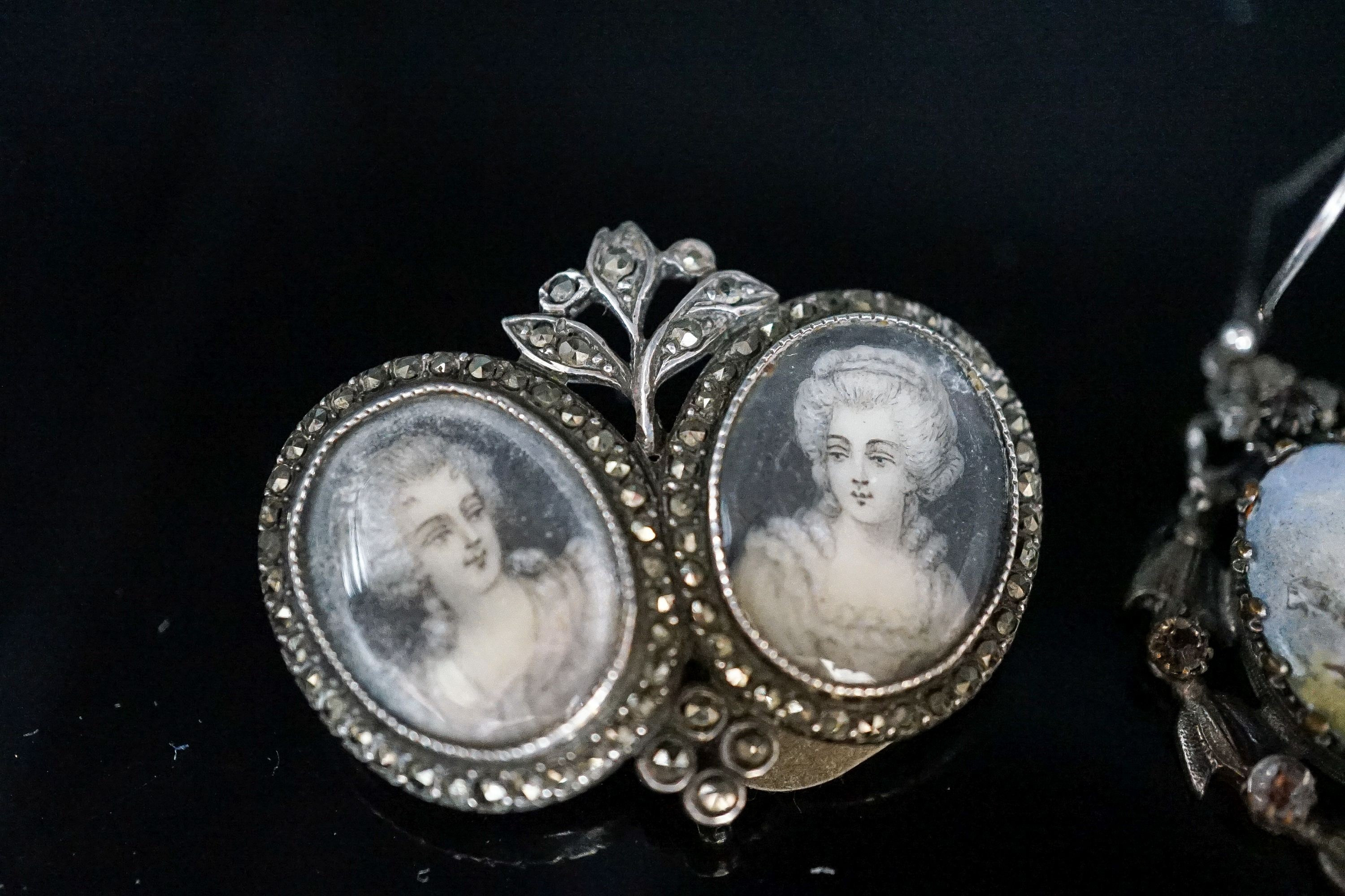 A pair of white metal, enamel and paste earrings, 34mm, a marcasite set double portrait brooch and a turquoise set buckle.